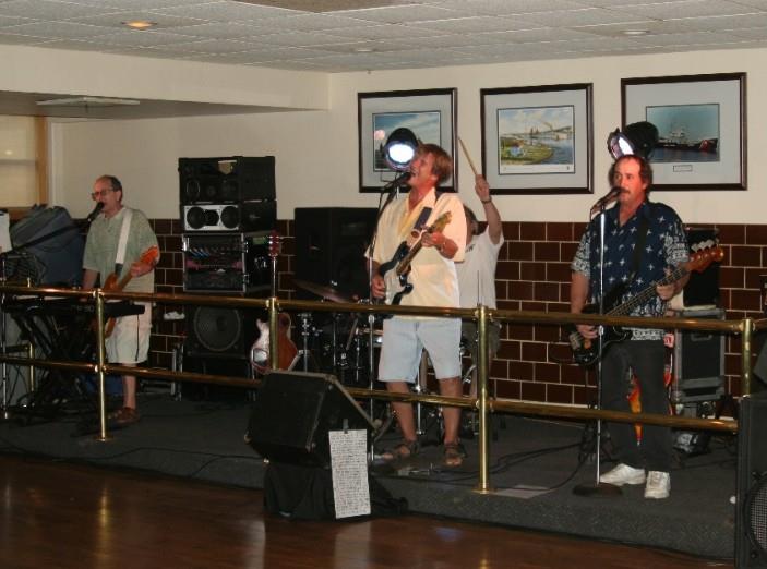 Musicians entertain a crowd with energetic performances at a community venue.