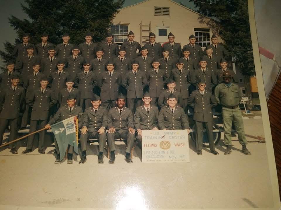 A group of people in uniform posing for a photo