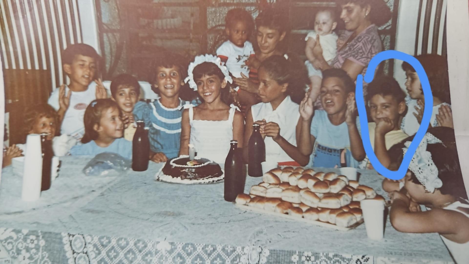 Kids celebrate a birthday with cake, snacks, and laughter in a happy atmosphere.