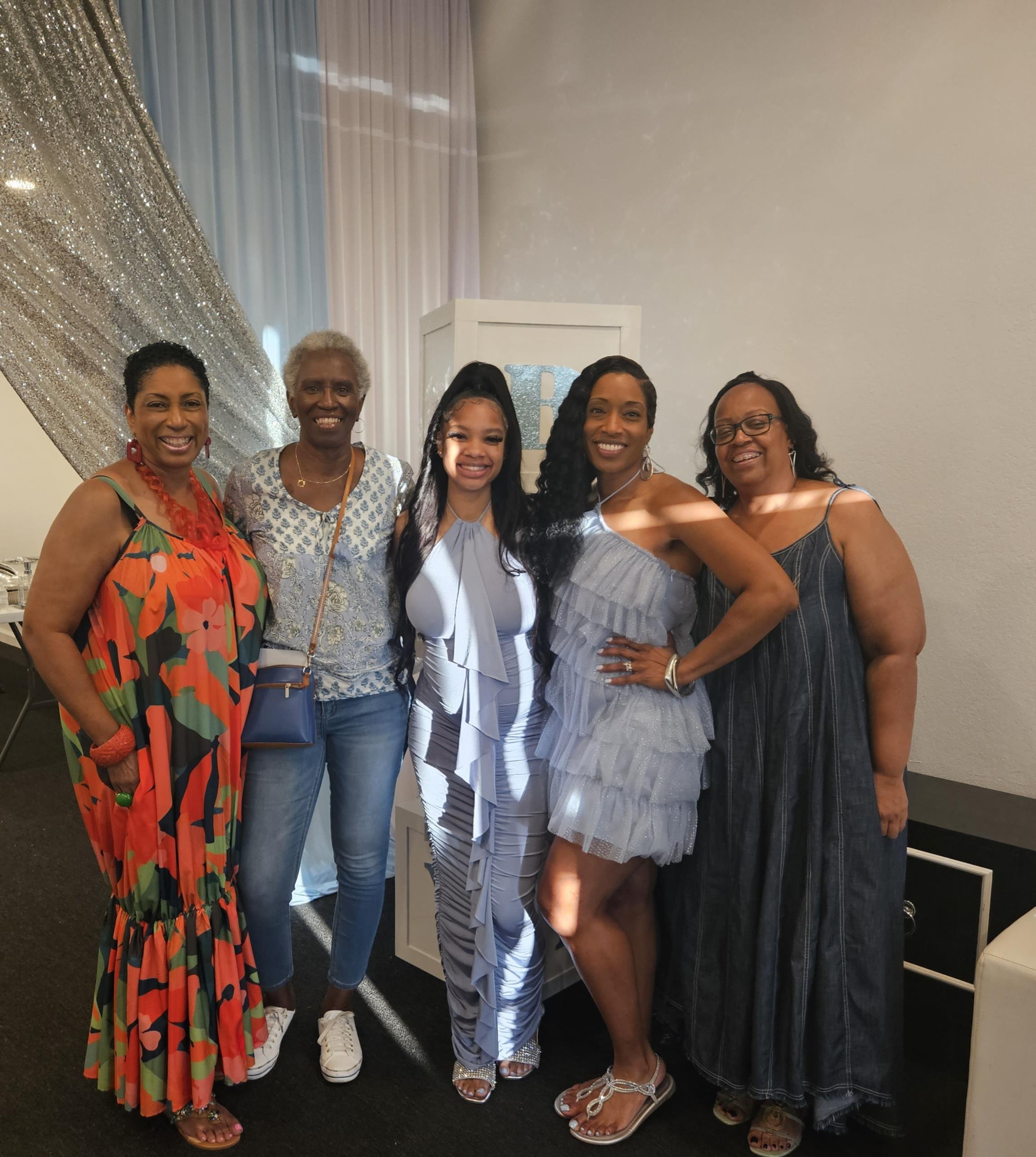 Friends gather together for a joyful celebration in an elegantly decorated indoor space.