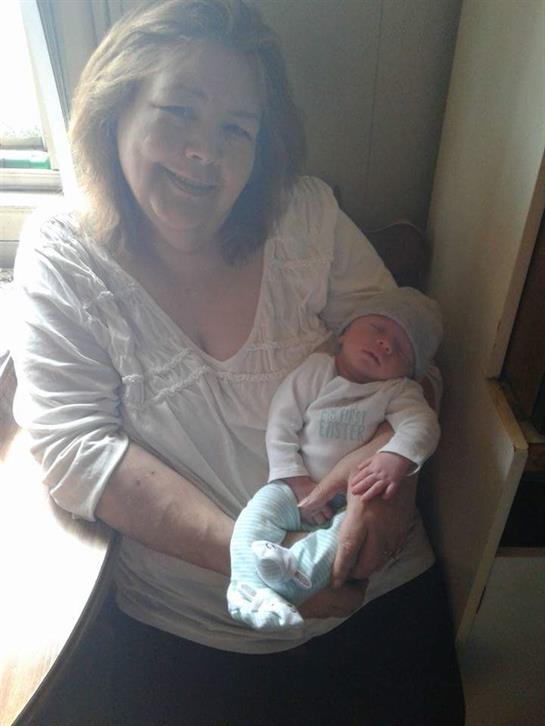 A woman holding a baby
