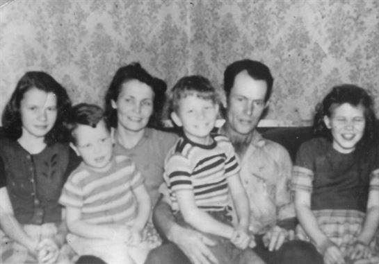 A family sitting together on a couch