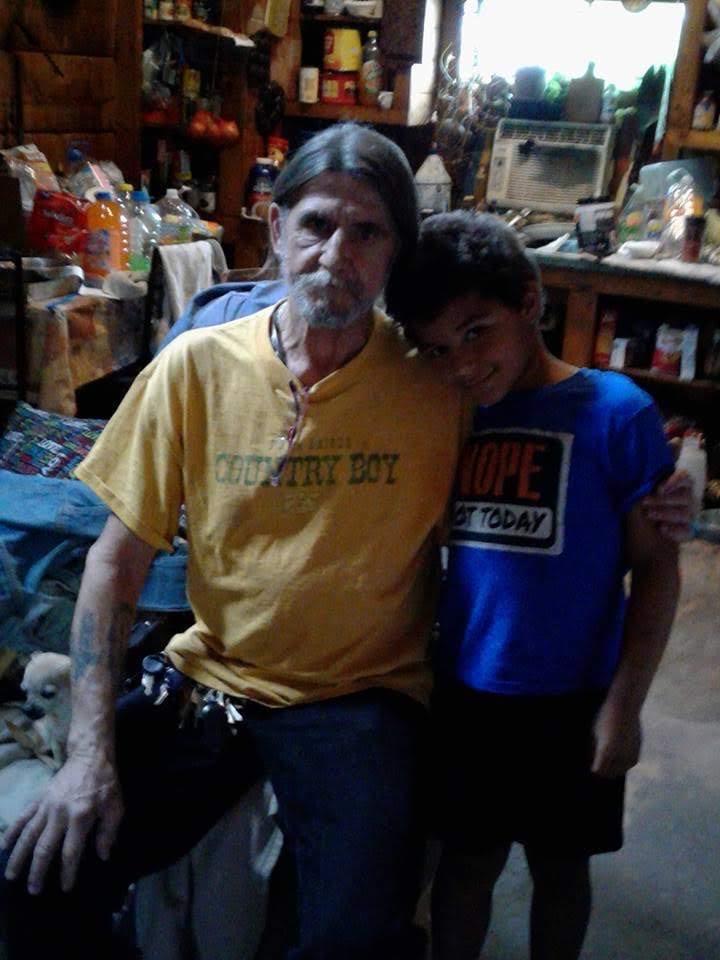 A man and boy posing for a picture