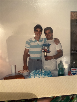 Friends enjoy a joyful moment together while celebrating with drinks and snacks.