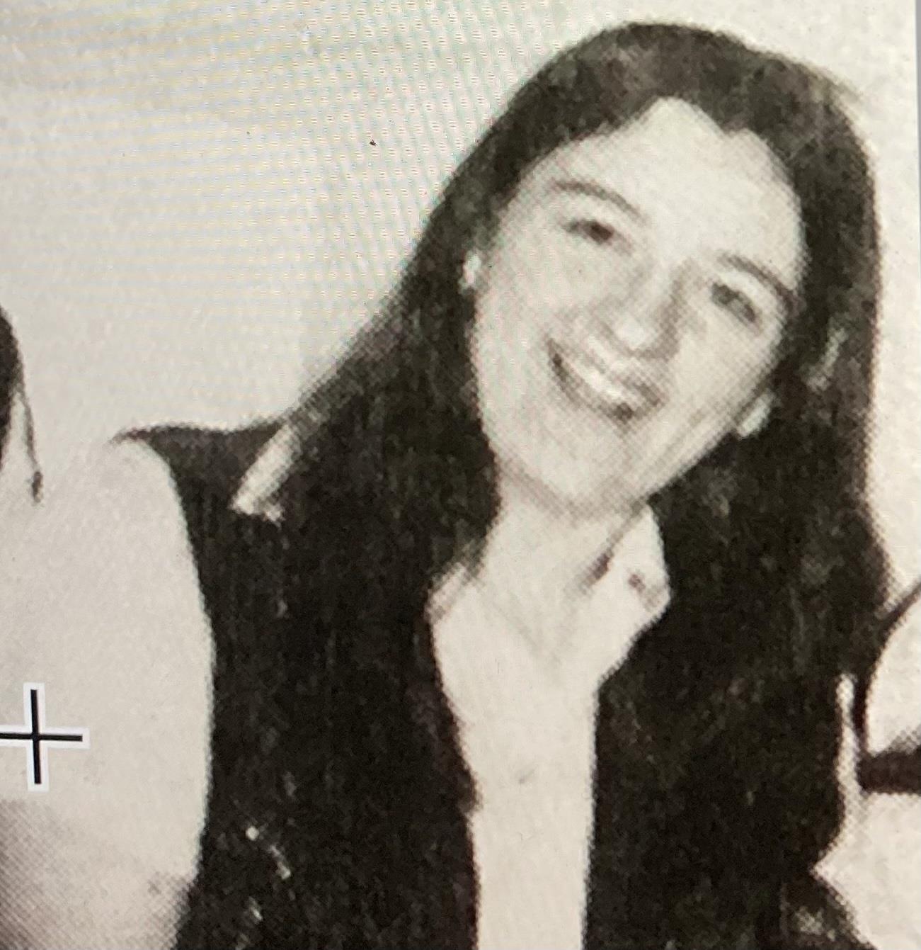 Group of friends enjoy a cheerful moment together, sharing laughter and joy in bright sunlight.