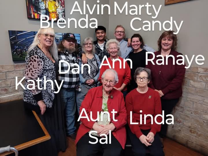 A cheerful gathering of friends and family celebrating together in a cozy setting.