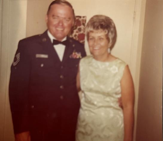 A man and woman posing for a picture