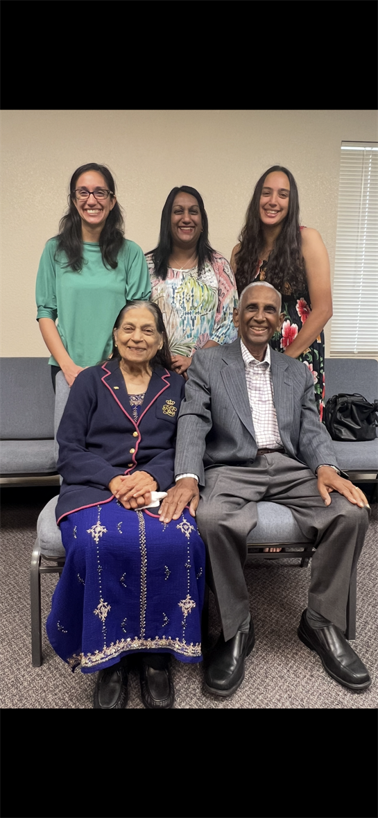 Family members smile together, showcasing love and connection during a joyful gathering.