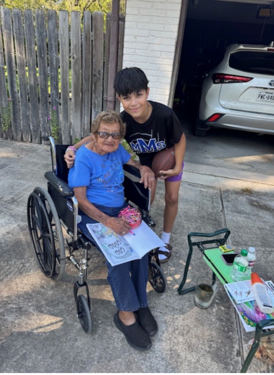 A boy and woman in a wheelchair