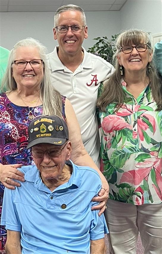 A joyful family gathers together, showcasing love and connection among generations amid smiles.