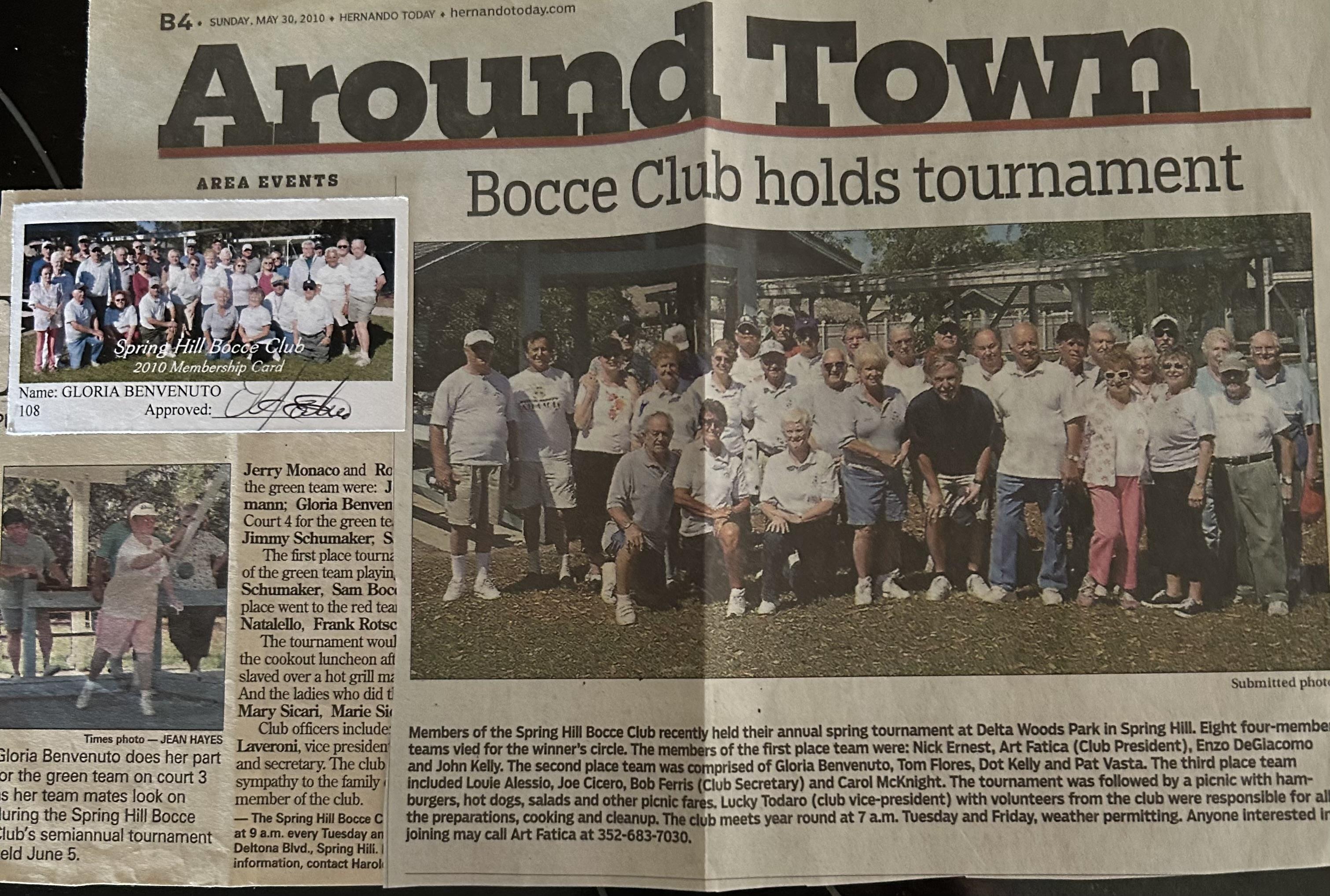 Participants enjoy friendly competition at a bocce ball tournament in a vibrant park setting.