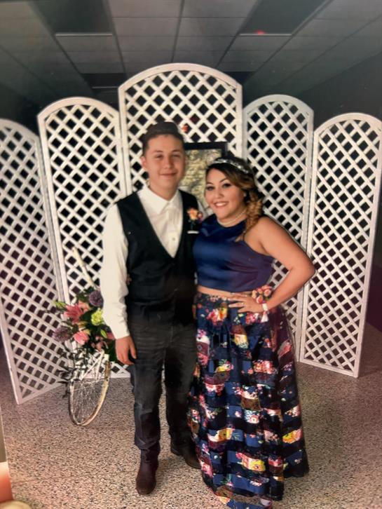 A man and woman posing for a picture