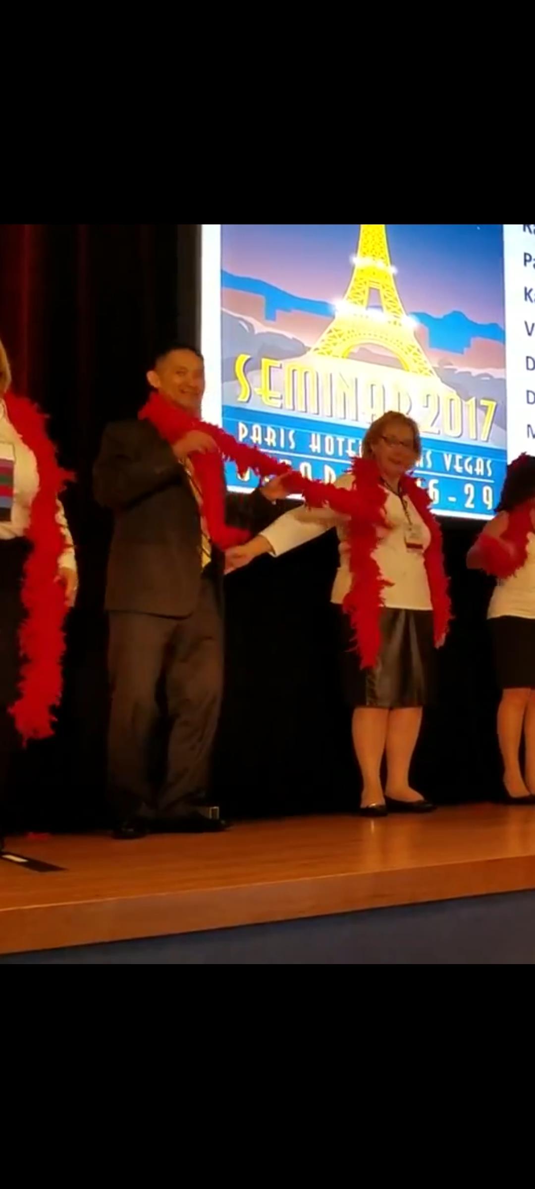 Attendees have fun in Las Vegas, donning colorful leis and joining in activities.