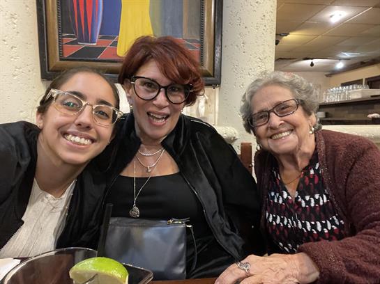 Family members share laughter and stories while dining in an inviting restaurant setting.