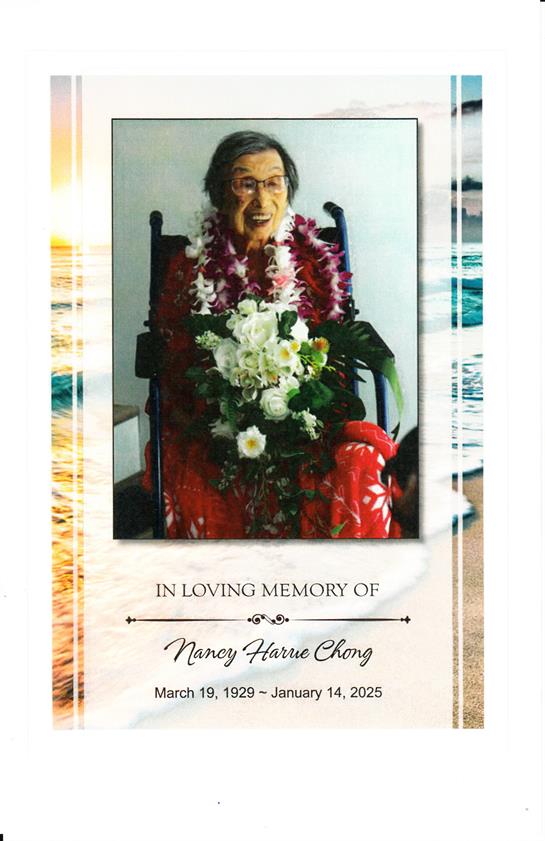 A woman sits in a chair surrounded by flowers, honoring her memory with love and care.