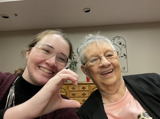Two women smiling and taking a selfie