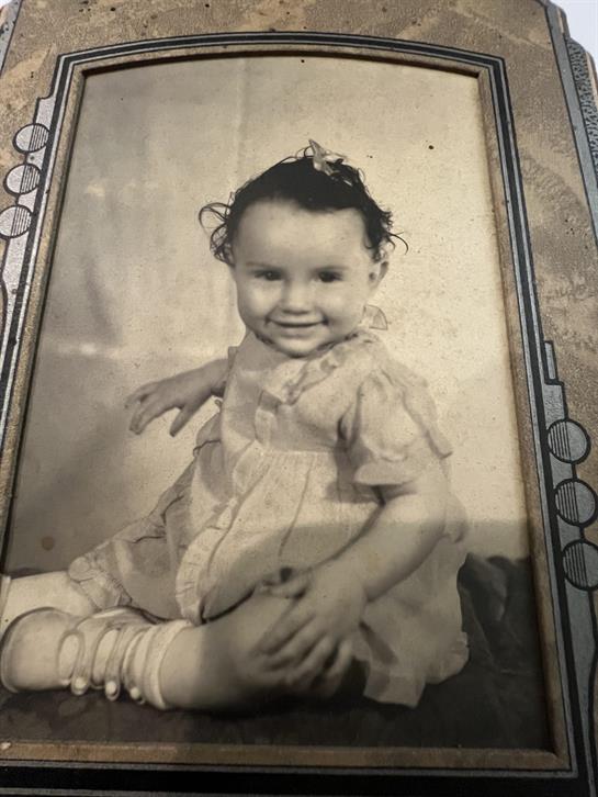 A black and white photo of a baby
