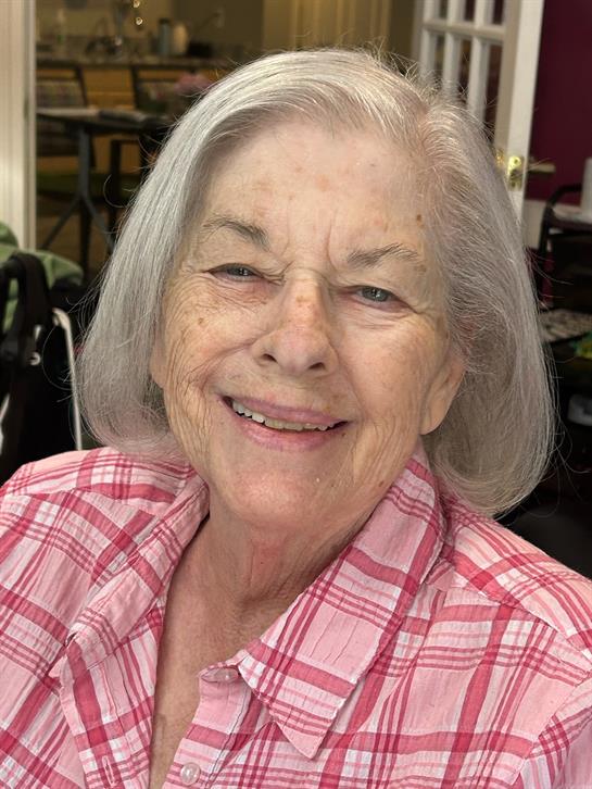 A woman smiling at the camera
