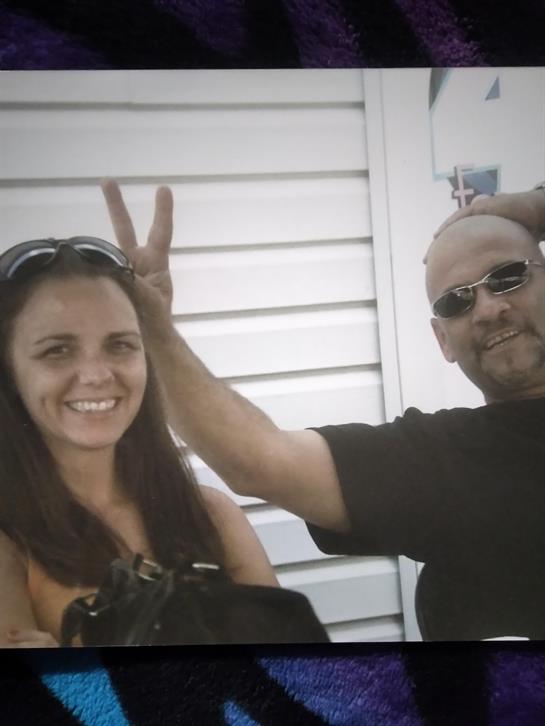 A man and woman posing for a picture