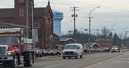A white van driving down the road