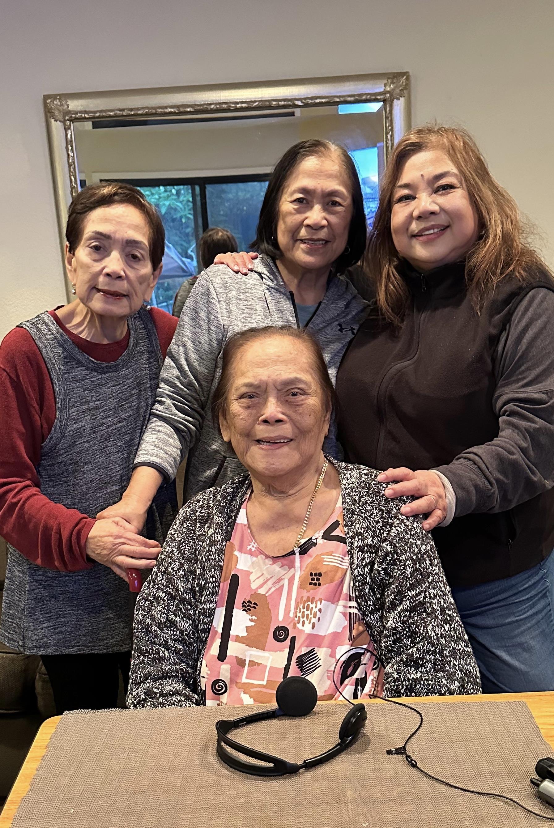 Women engage in lively conversation and laughter, enjoying a meaningful gathering together.