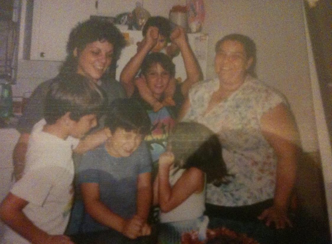 A lively family gathering showcases children and adults sharing a joyful moment together.