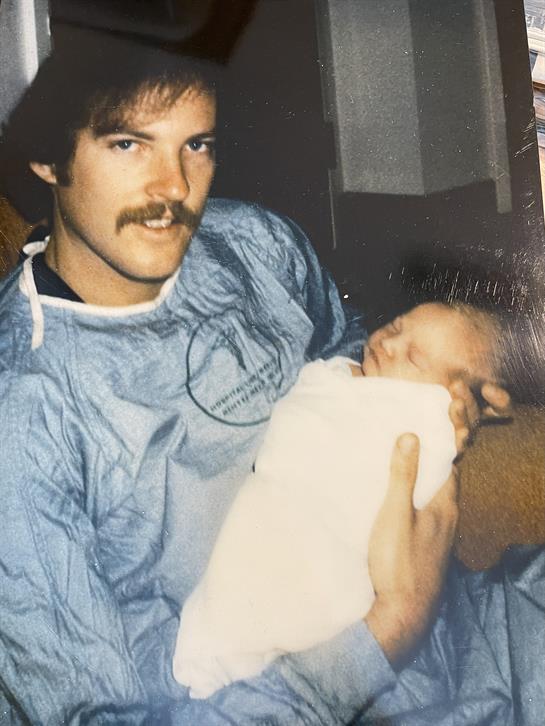 A man holding a baby