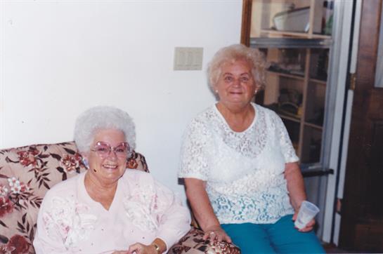 Two women sitting in chairs