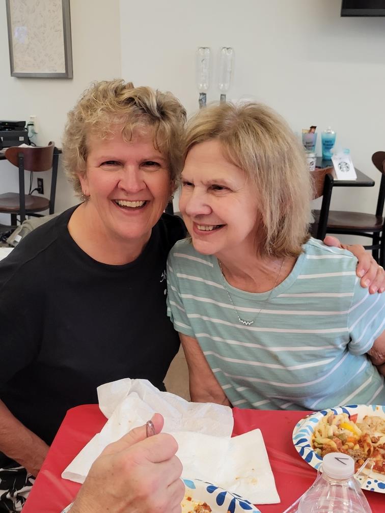 Friends share laughter and stories while enjoying lunch at a lively eatery.