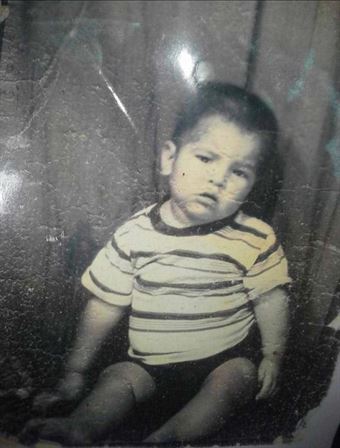 A baby sitting on the floor