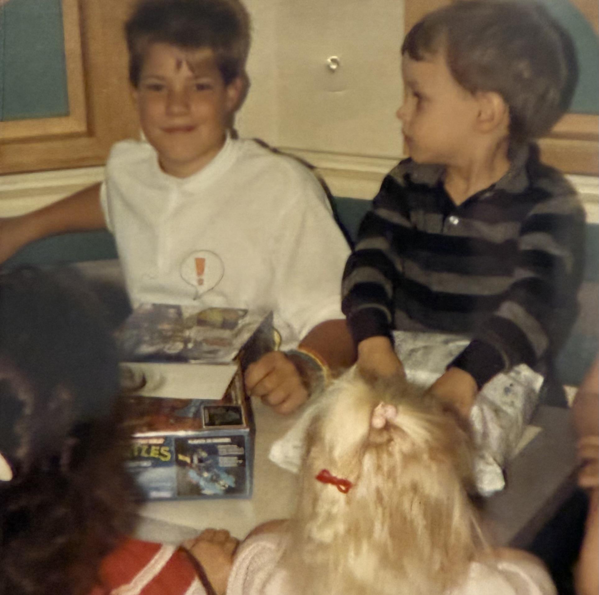 Kids enjoy birthday festivities, sharing cake and laughter at a lively celebration with friends.