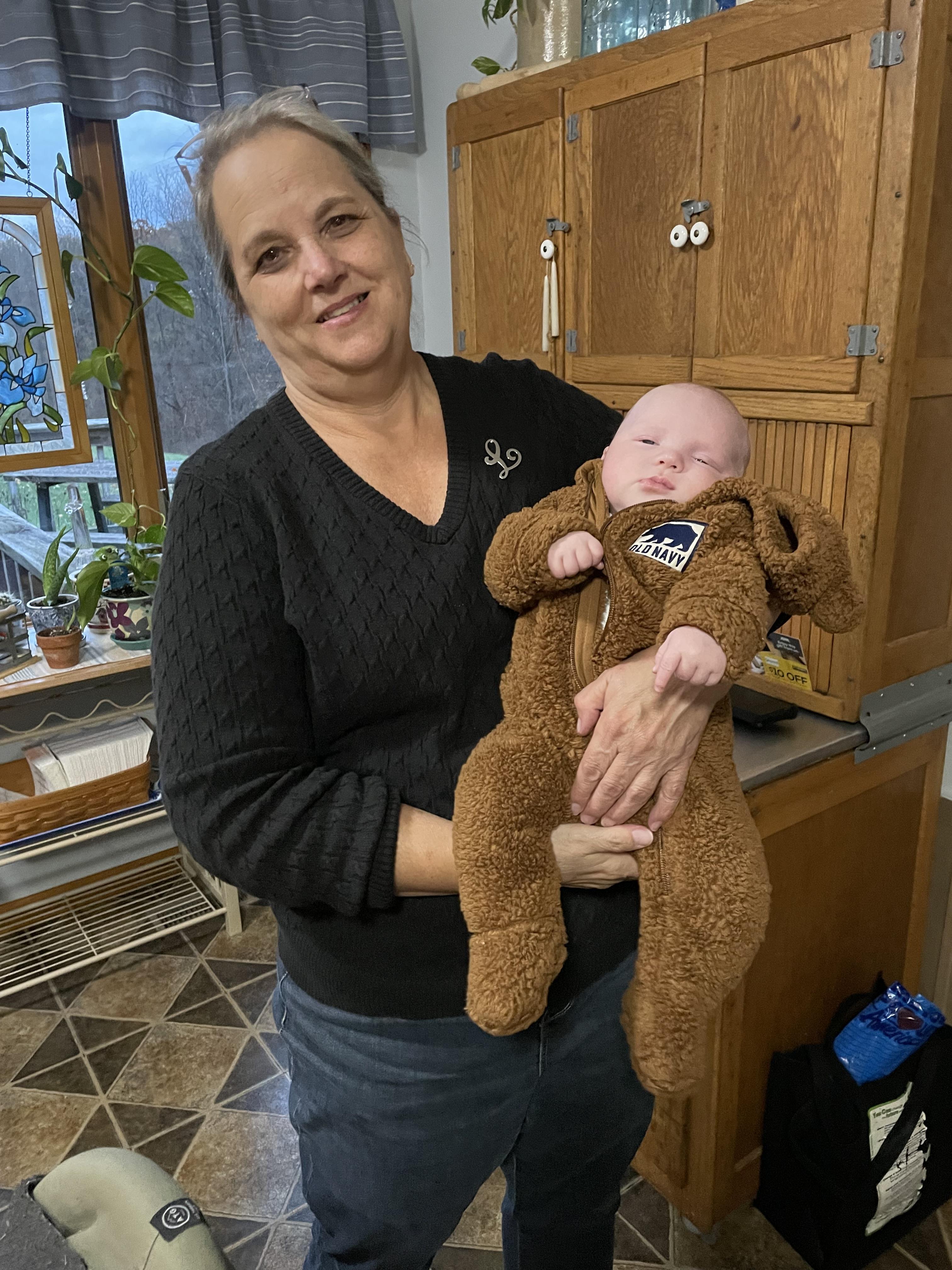 A woman holding a baby