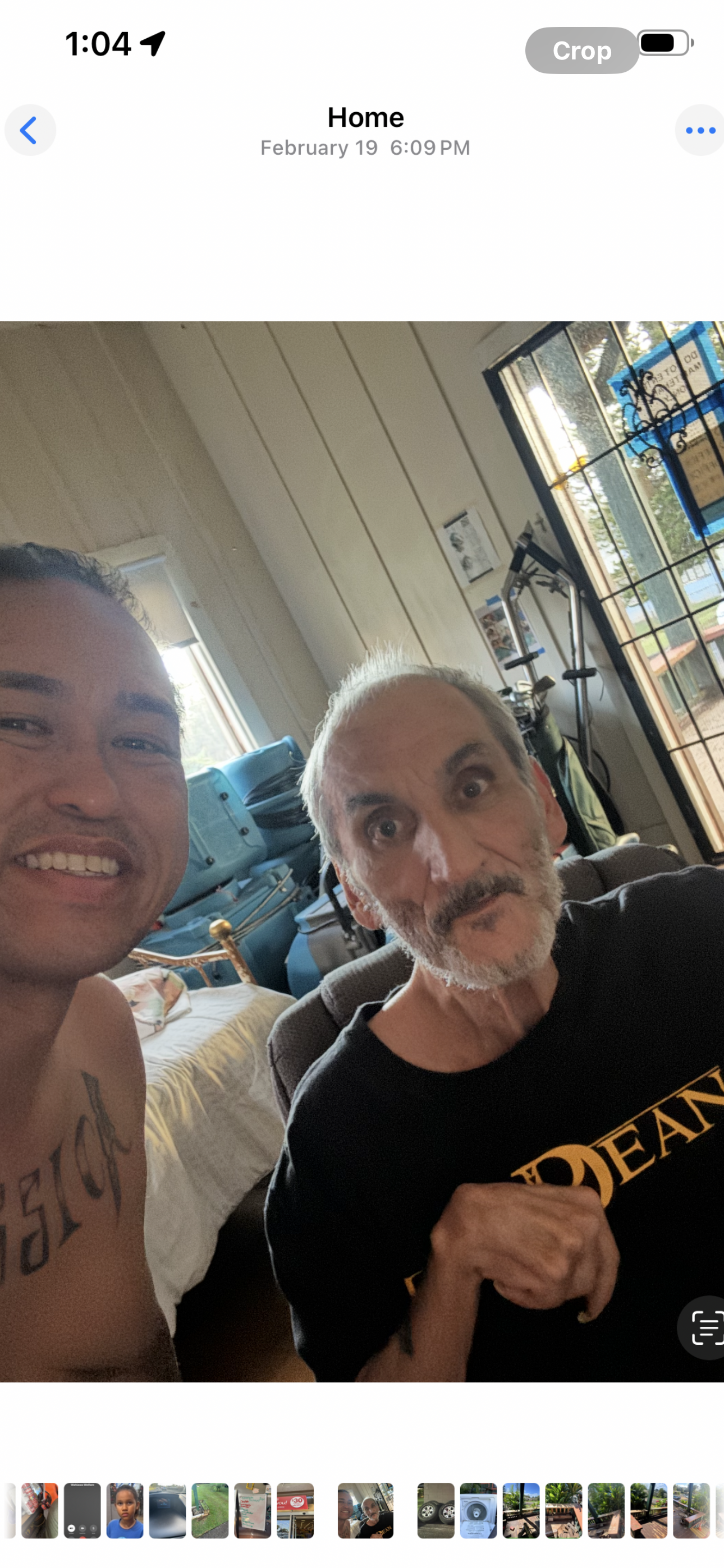 Two individuals enjoy a warm moment together in a comfortable indoor setting.