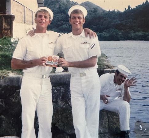 A group of men in white uniforms