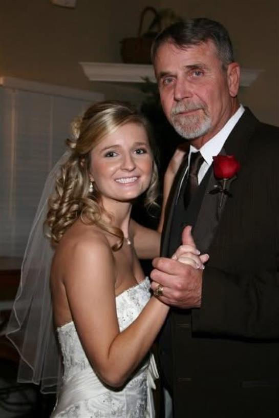 A man and woman posing for a picture