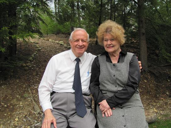 A man and woman sitting on a bench