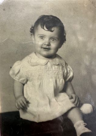 A baby in a dress