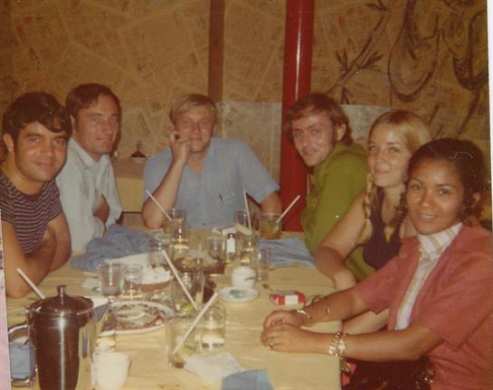 A group of people sitting around a table