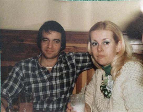 A man and woman sitting at a table