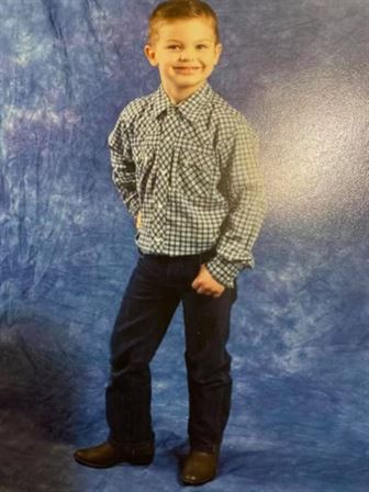 A boy posing for a picture