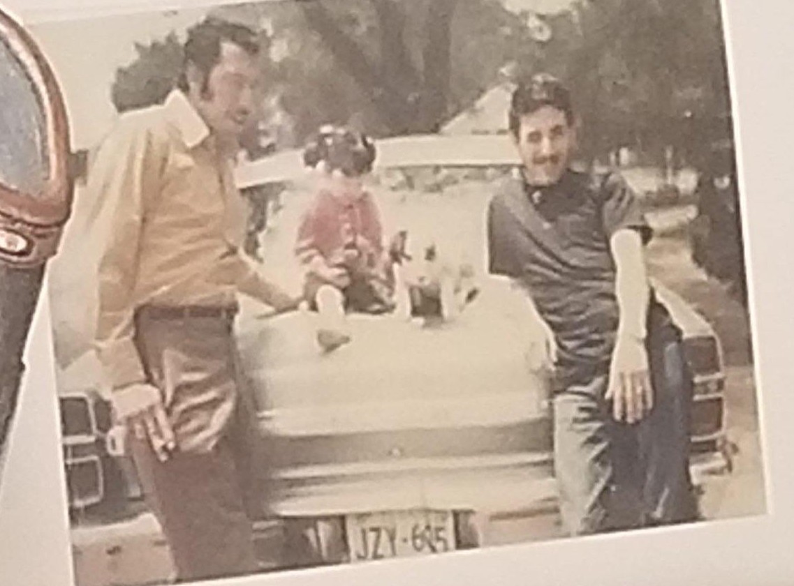 A group of men sitting in a car