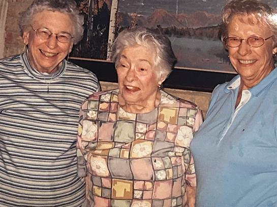A group of older women smiling