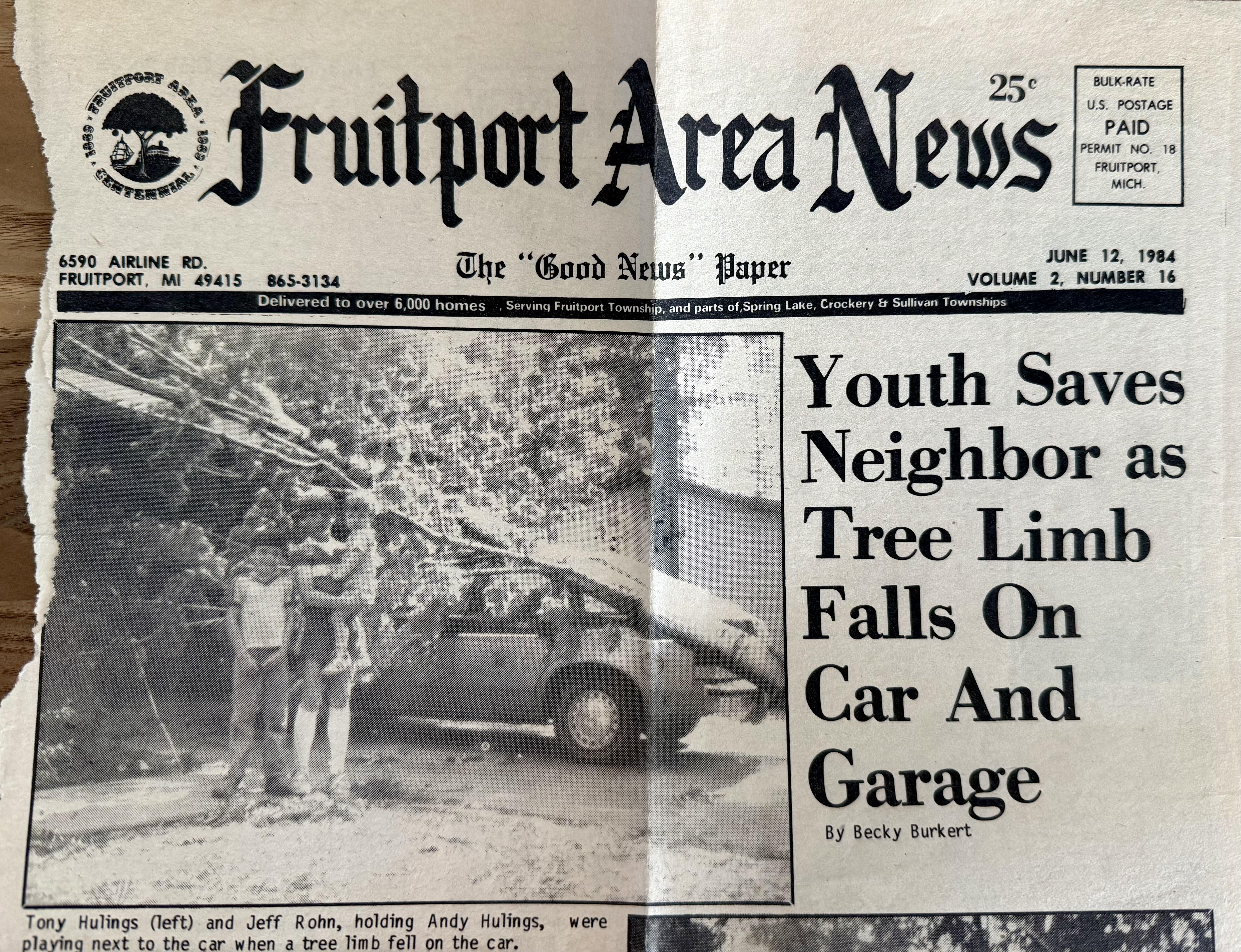 A brave youth assists a neighbor after a tree limb crashes onto their car and garage.