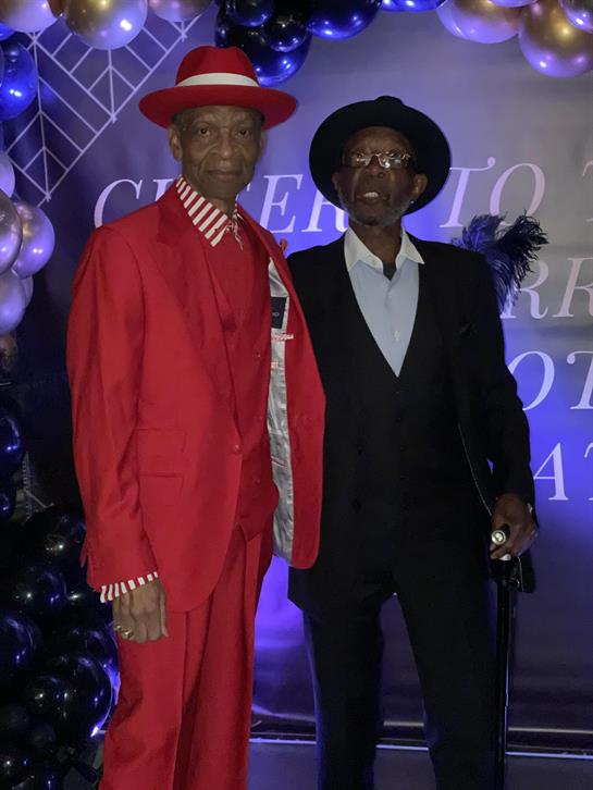 Two men standing next to each other