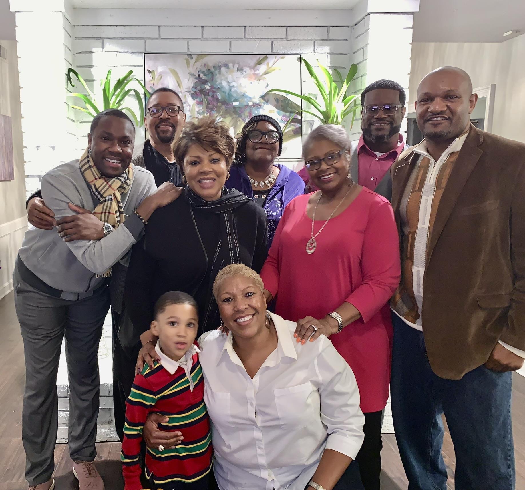 A cheerful family reunion takes place in a well-decorated space filled with joy and connection.