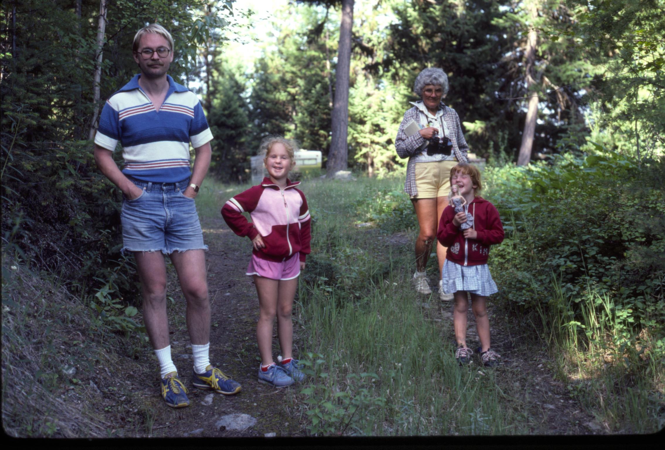 A group of people standing in the woods