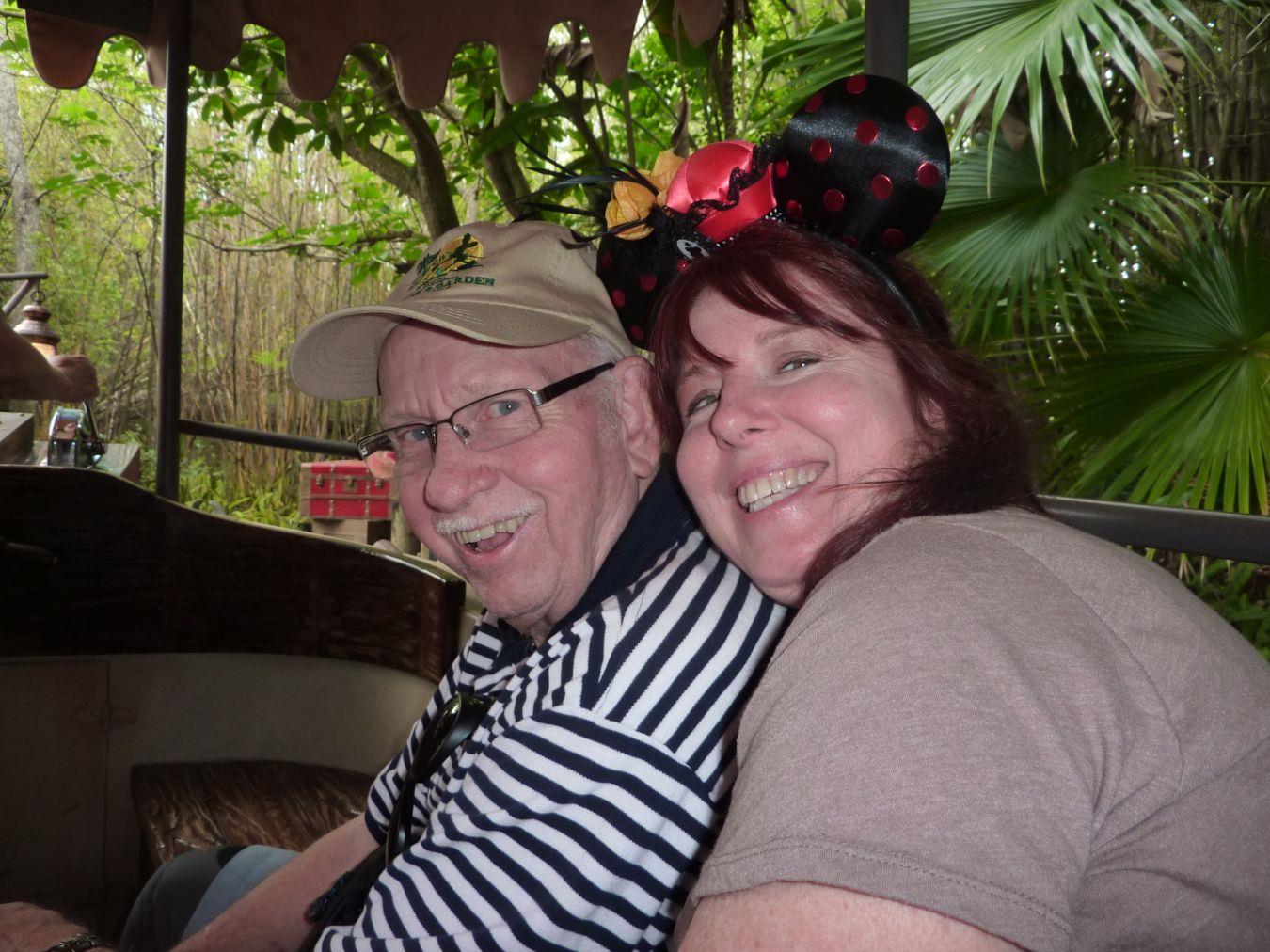 Two happy people share joyful moments in a lush, friendly environment.