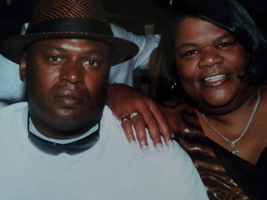 A couple shares smiles and laughter at a lively event, showcasing their happiness and connection.