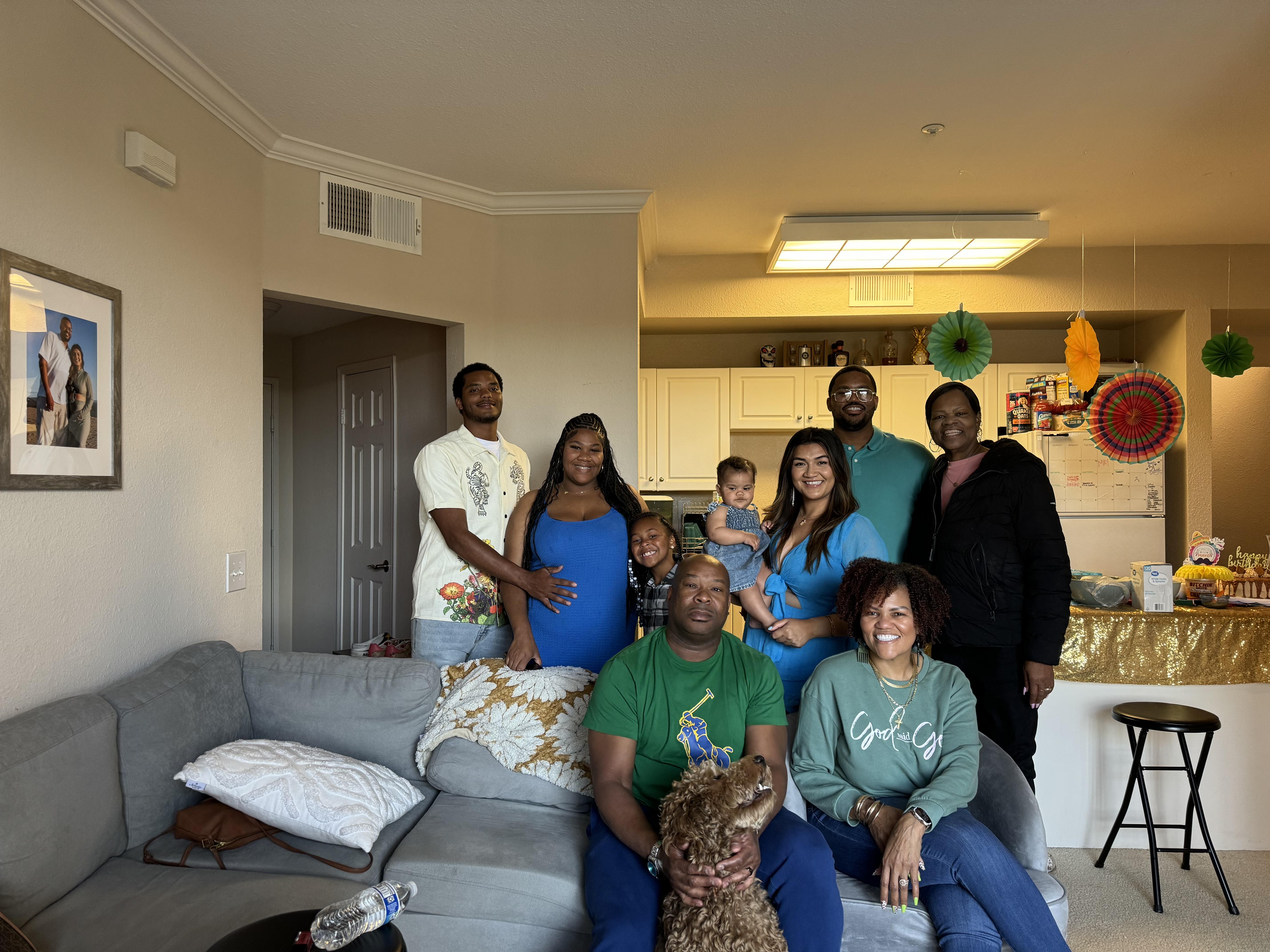Family enjoying quality time in a warm, bright living room full of laughter.