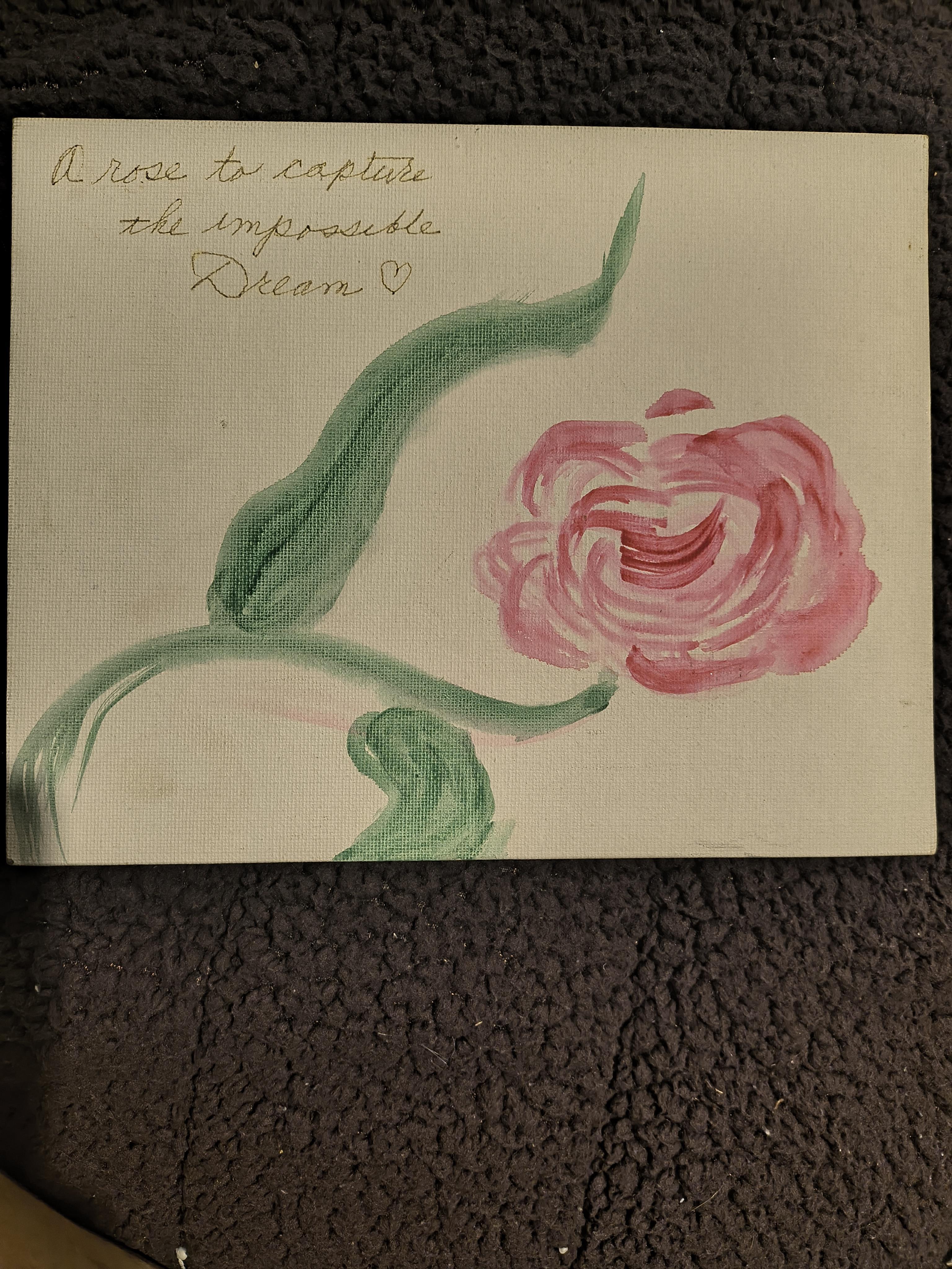 A colorful artwork features a pink rose and green leaves, expressing the theme of dreams.